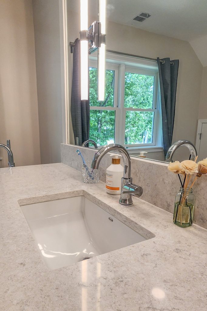 Timeless farmhouse - Elevated Designs: closeup of vanity sink and hardware