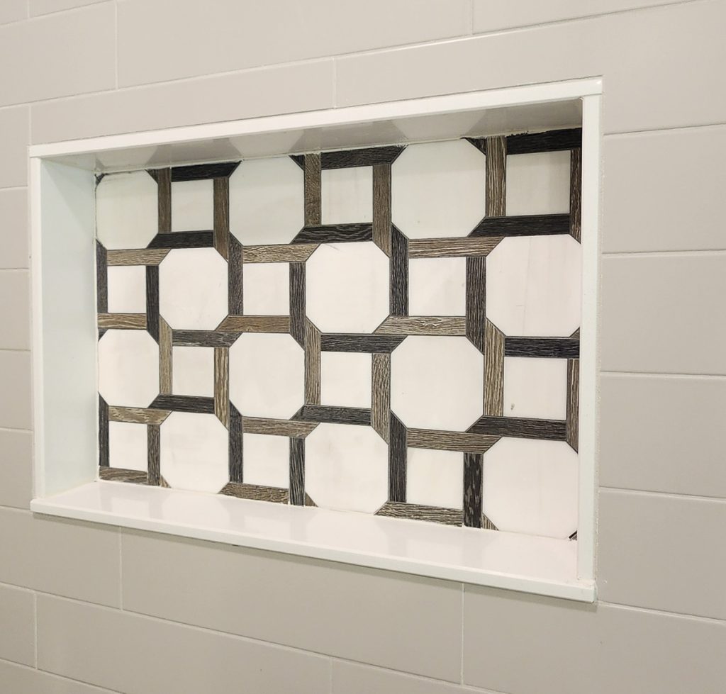 Timeless farmhouse - Elevated Designs: closeup of tile storage inset in the shower