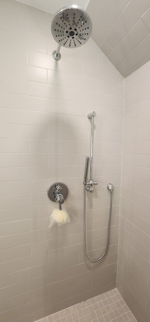 Timeless farmhouse - Elevated Designs: closeup of shower hardware