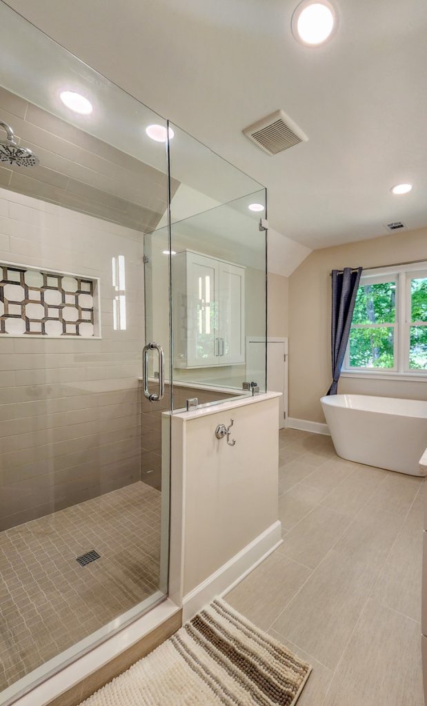 Timeless farmhouse - Elevated Designs: View of shower and bathtub